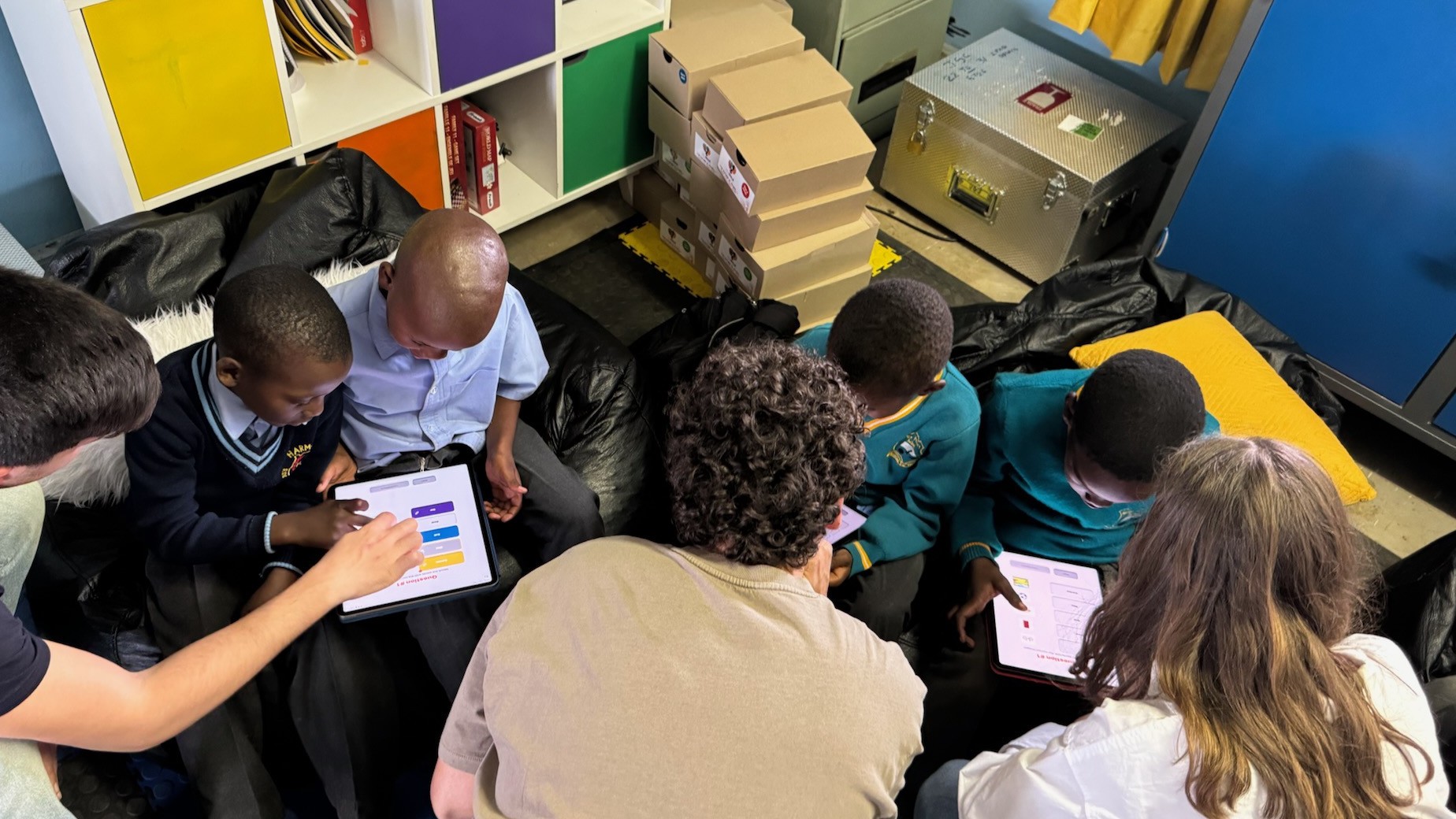 Learners completing assessments on iPad during on-site testing in Johannesburg