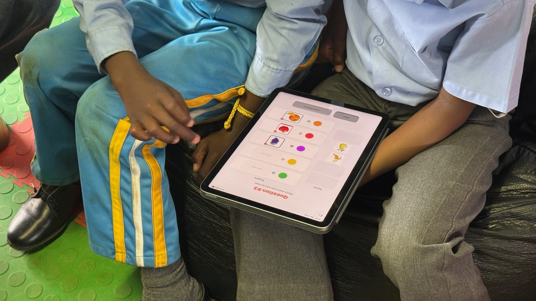 A learner answering a question on iPad during on-site testing in Johannesburg